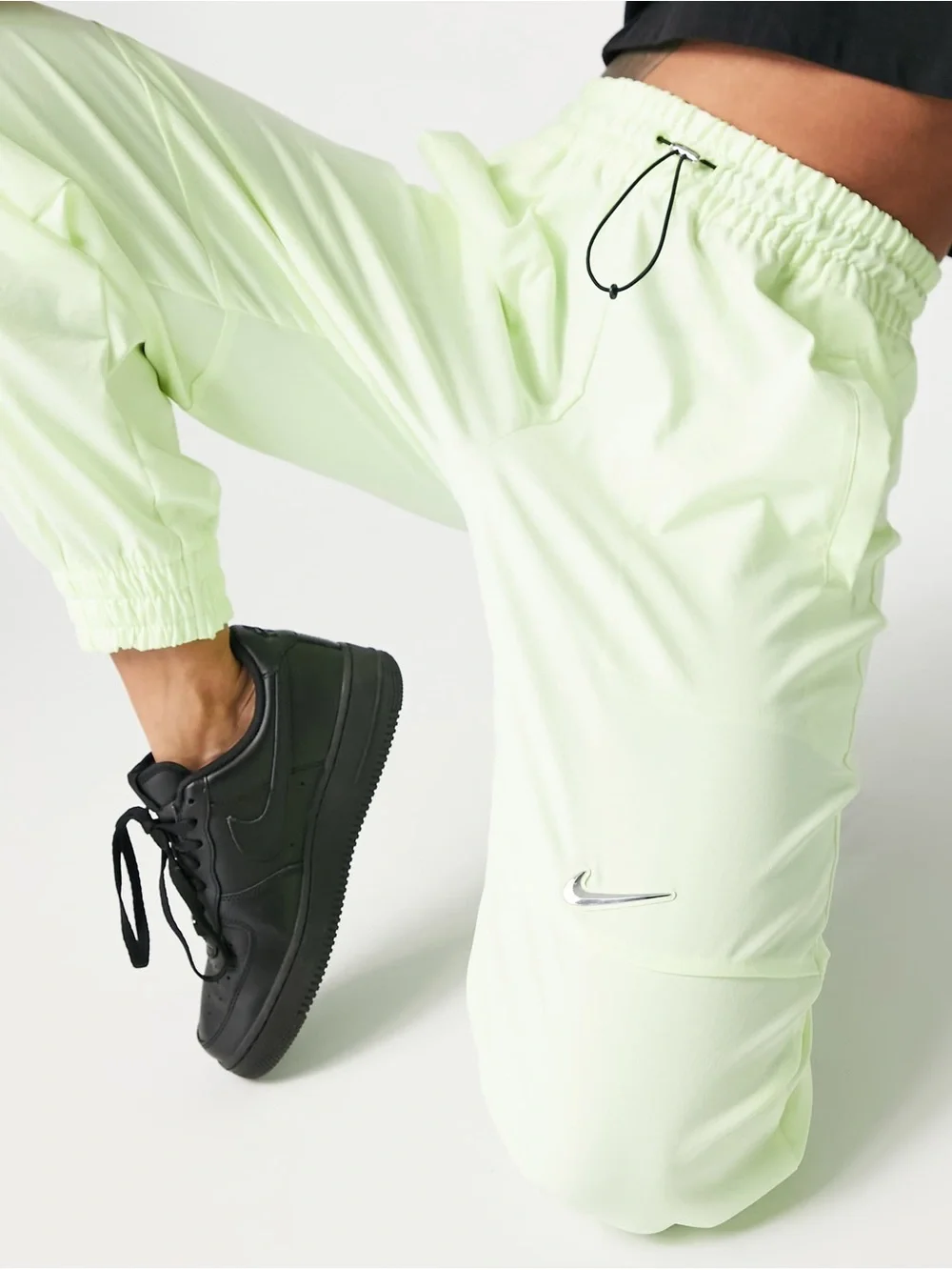 Nike Women's Sportswear Woven Pants in a bright neon green/yellow XS